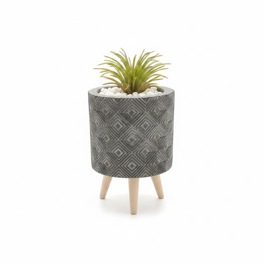 Artificial plant in pot on stand
