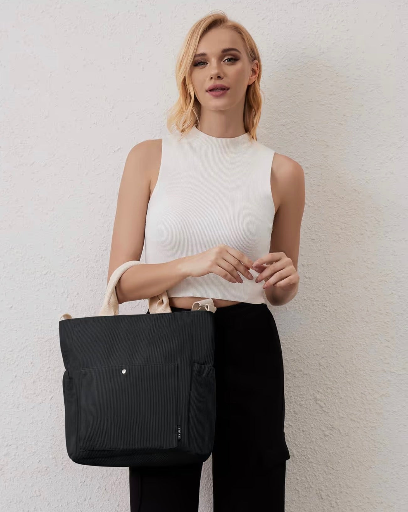Large black corduroy zipped tote bag.