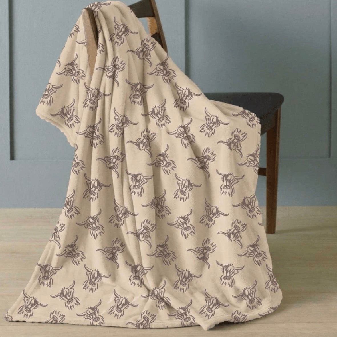 Highland cow design fleece blanket.