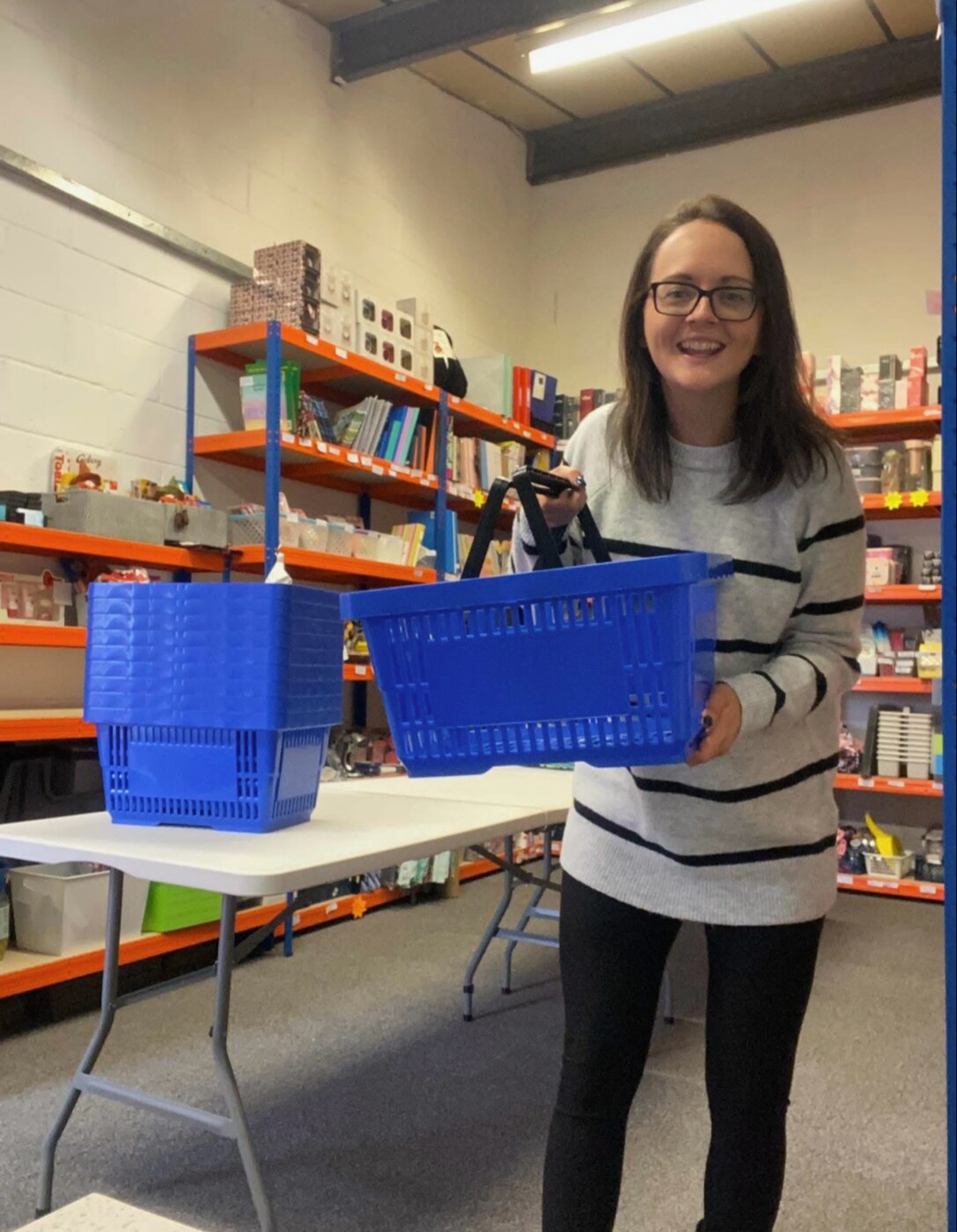 Zoe preparing shopping baskets inside Store 22
